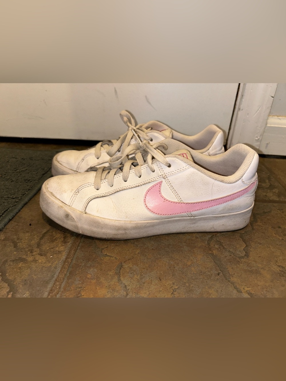 Nike Women’s White Leather Sneakers with Pink Swoosh Accent
